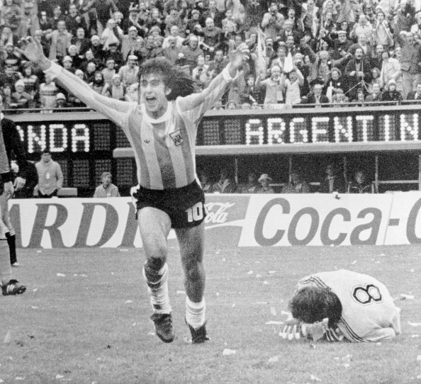 (Original Caption) World Cup Final. With defeated Dutch goalie Jan Jongbloed (8) at his feet, Argentina's Mario Kempes runs off jubilating after sc...