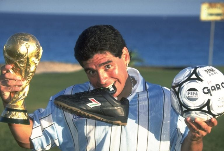 27 Dec 1994:  Portrait of Diego Maradona of Argentina with his World Cup trophy, boot and ball in Cancun, Mexico.  Mandatory Credit: David  Cannon/...
