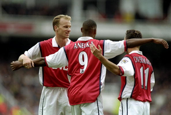 4 Oct 1998:  Nicolas Anelka of Arsenal is congratulated by his team-mates Dennis Bergkamp and Marc Overmars after scoring a goal during the FA Carl...