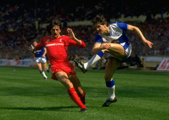 10 May 1986:  Gary Lineker of Everton shoots past Mark Lawrenson during the FA Cup Final at Wembley Stadium in London. Liverpool won the match 3-1....