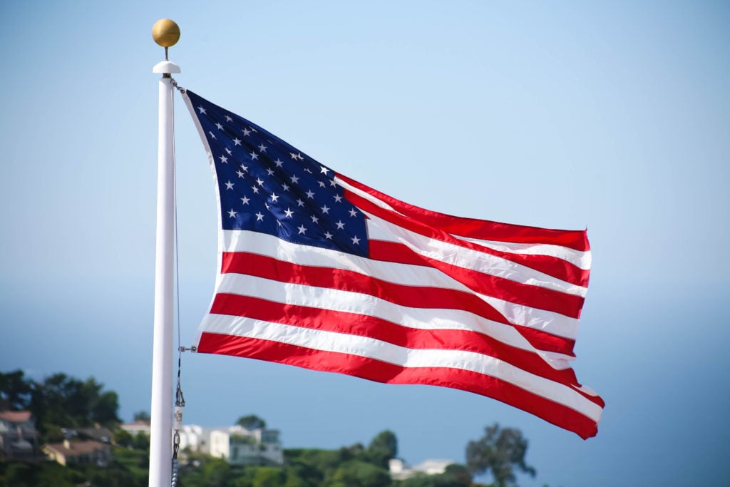 American flag, US flag, USA flag, United States of America flag flying in sky