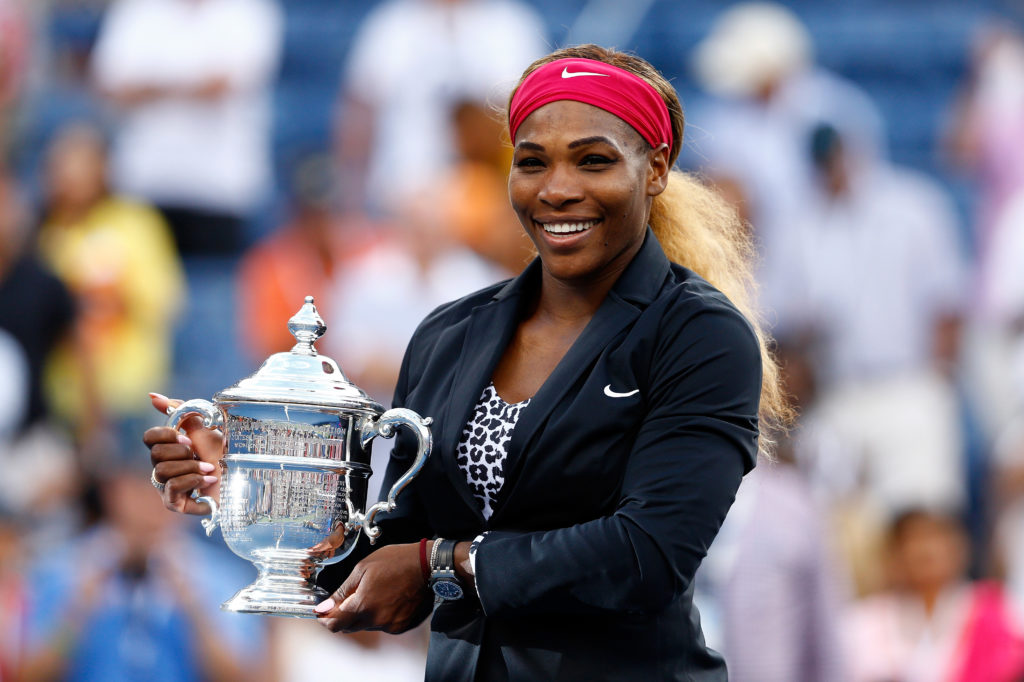 Serena Williams holding the US Open title in 2014.
