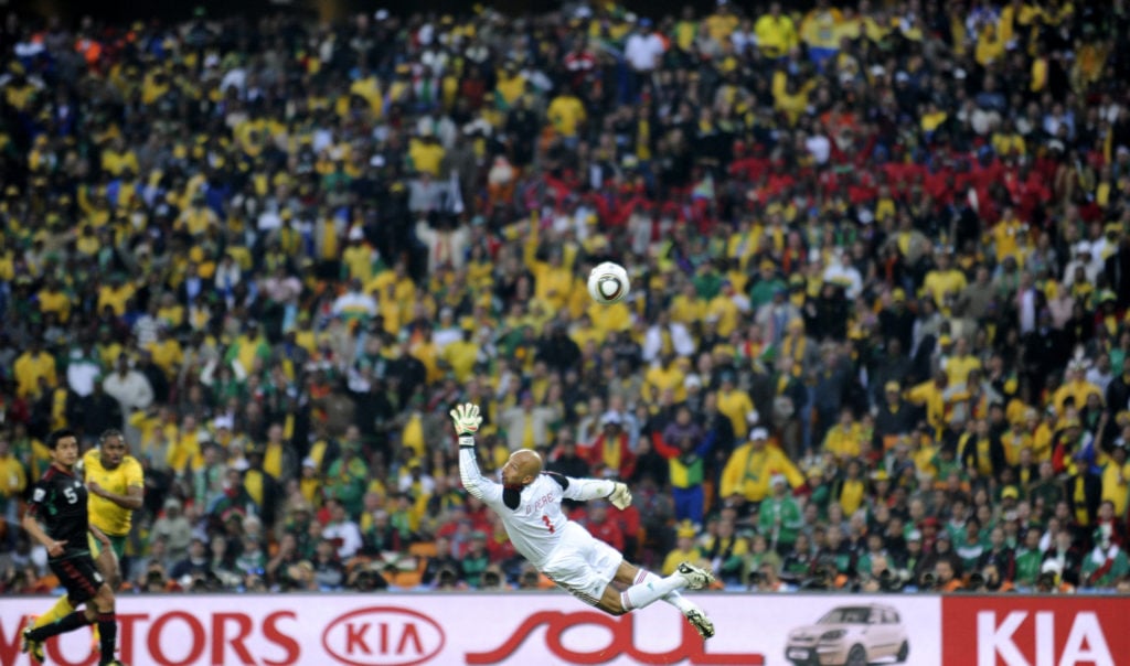 Mexico's goalkeeper Oscar Perez fails to