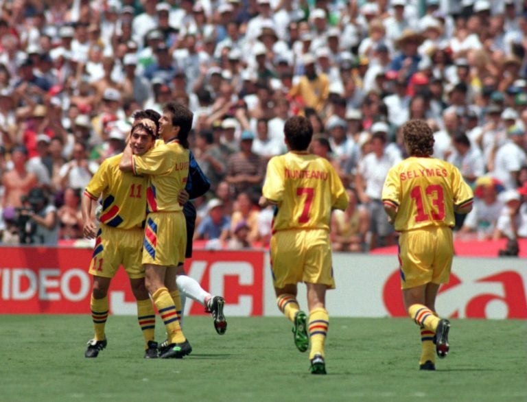 3 JUL 1994:  ILIE DUMITRESCU #11 OF ROMANIA IS CONGRATULATED BY HIS teammates AFTER SCORING THE OPENING GOAL DURING THE ROMANIA VERSUS ARGENTINA 19...