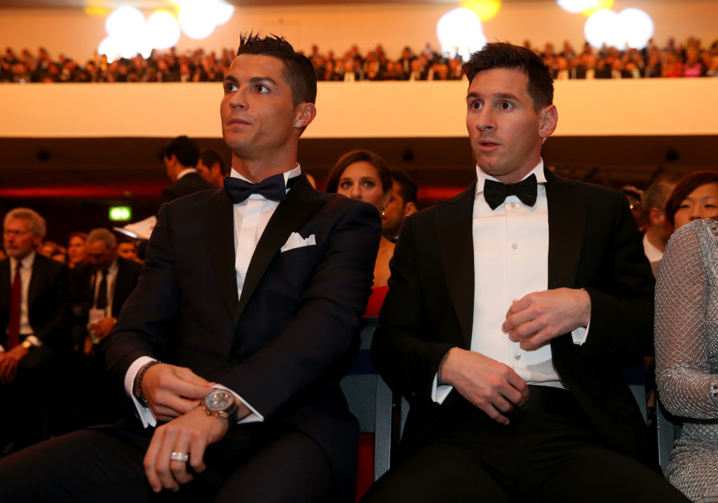 FIFA Ballon d'Or nominee Cristiano Ronaldo of Portugal and Real Madrid sits with FIFA Ballon d'Or nominee Lionel Messi of Argentina and Barcelona during the FIFA Ballon d'Or Gala 2015 at the Kongresshaus.