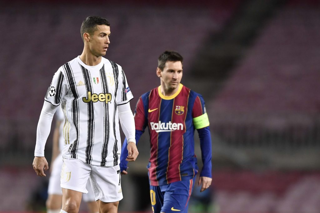 Cristiano Ronaldo of Juventus and Lionel Messi of FC Barcelona look on during the UEFA Champions League Group G stage match between FC Barcelona and Juventus at Camp Nou.