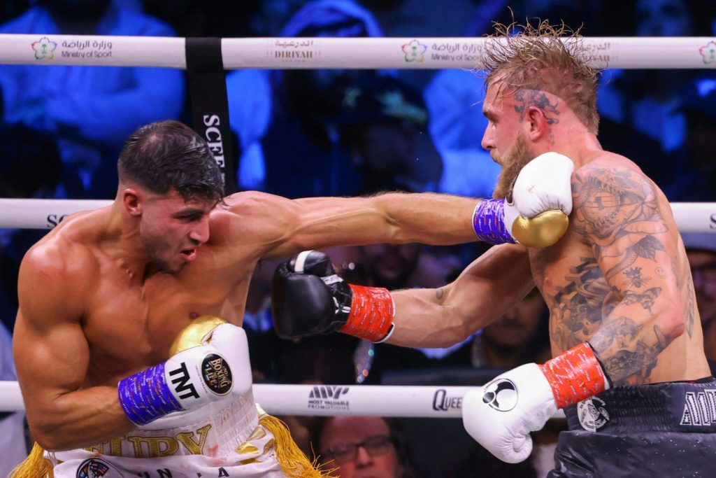 TOPSHOT - British reality TV star Tommy Fury (L) fights against US YouTuber Jake Paul during a boxing match held at Diriyah in Riyadh, Saudi Arabia on February 27, 2023.