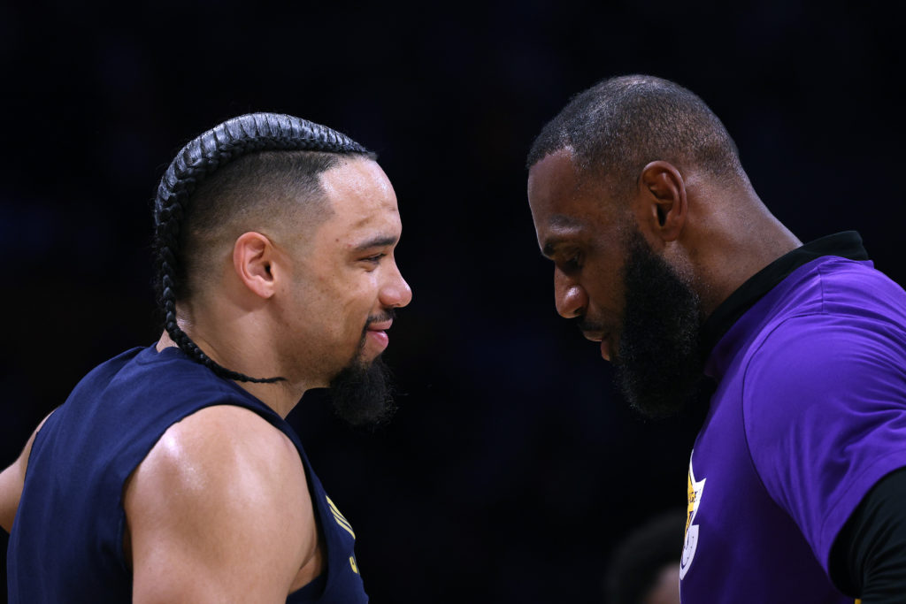 Dillon Brooks #24 of the Memphis Grizzlies and LeBron James #6 of the Los Angeles Lakers talk before Game Three of the Western Conference First Round Playoffs at Crypto.com Arena on April 22, 2023 in Los Angeles.