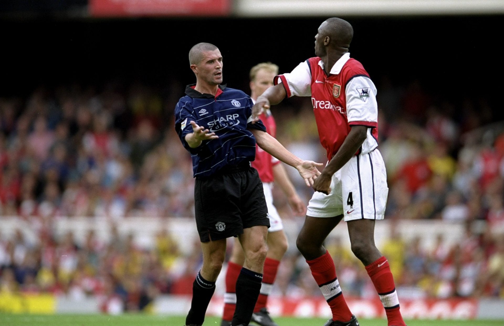 22 Aug 1999:  Roy Keane of Manchester United clashes with Patrick Vieira of Arsenal during the FA Carling Premiership match against Arsenal played ...