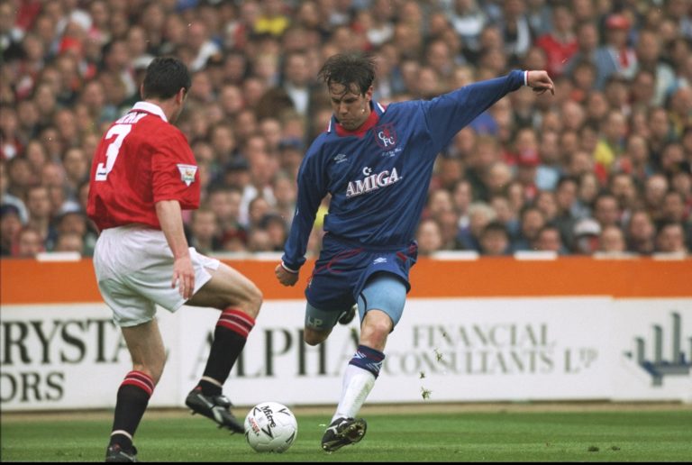 14 May 1994:  Denis Irwin (left) of Manchester United tries to block the shot of Craig Burley (right) of Chelsea during the FA Cup Final at  Wemble...