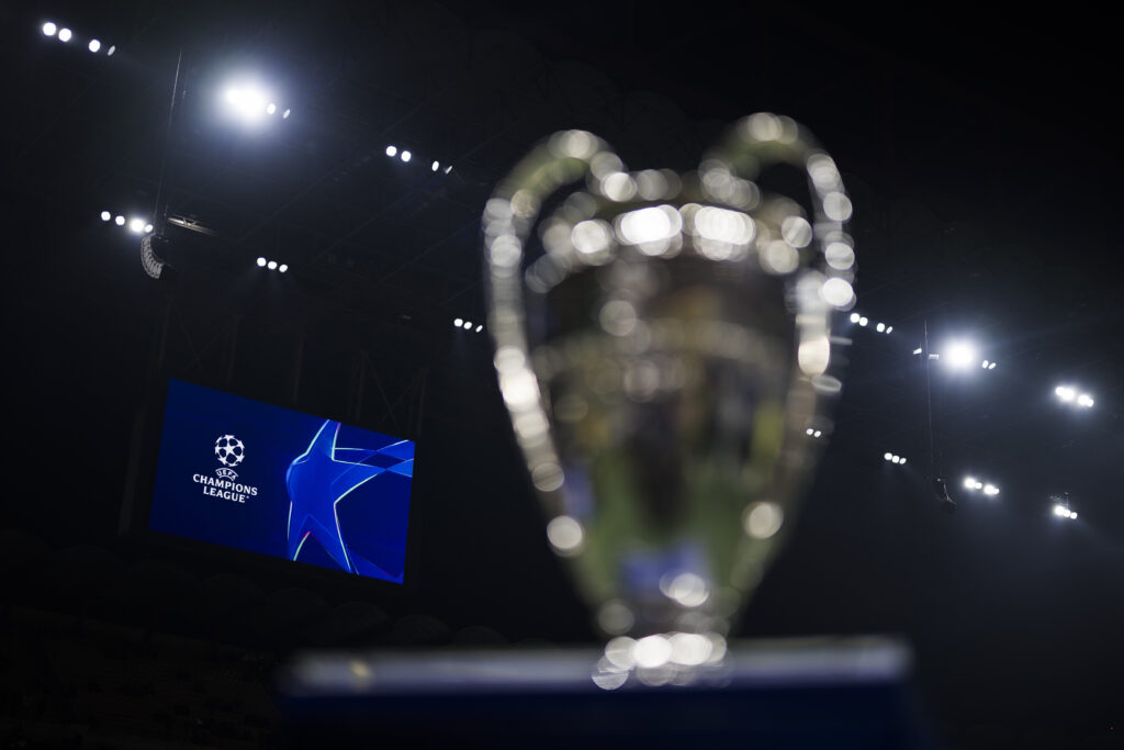 A scoreboard displays the logo of the UEFA Champions League