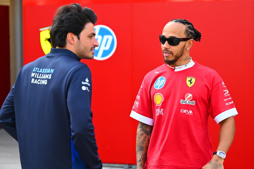 Lewis Hamilton and Carlos Sainz speak during day three of F1 testing in Bahrain
