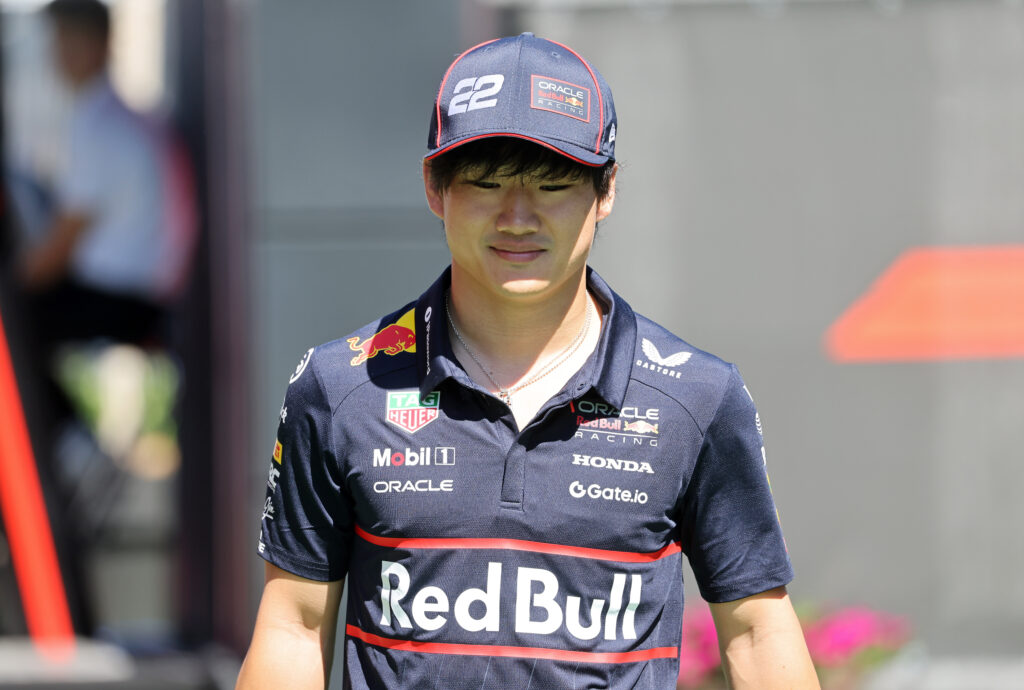 Yuki Tsunoda of Oracle Red Bull Racing walks in the paddock