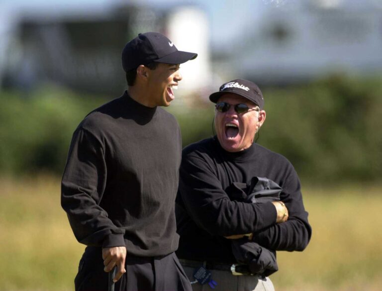 18 Jul 2000:  Tiger Woods of the USA shares a joke with his coach Butch Harmon during the second practice round at the 2000 British Open golf Champ...