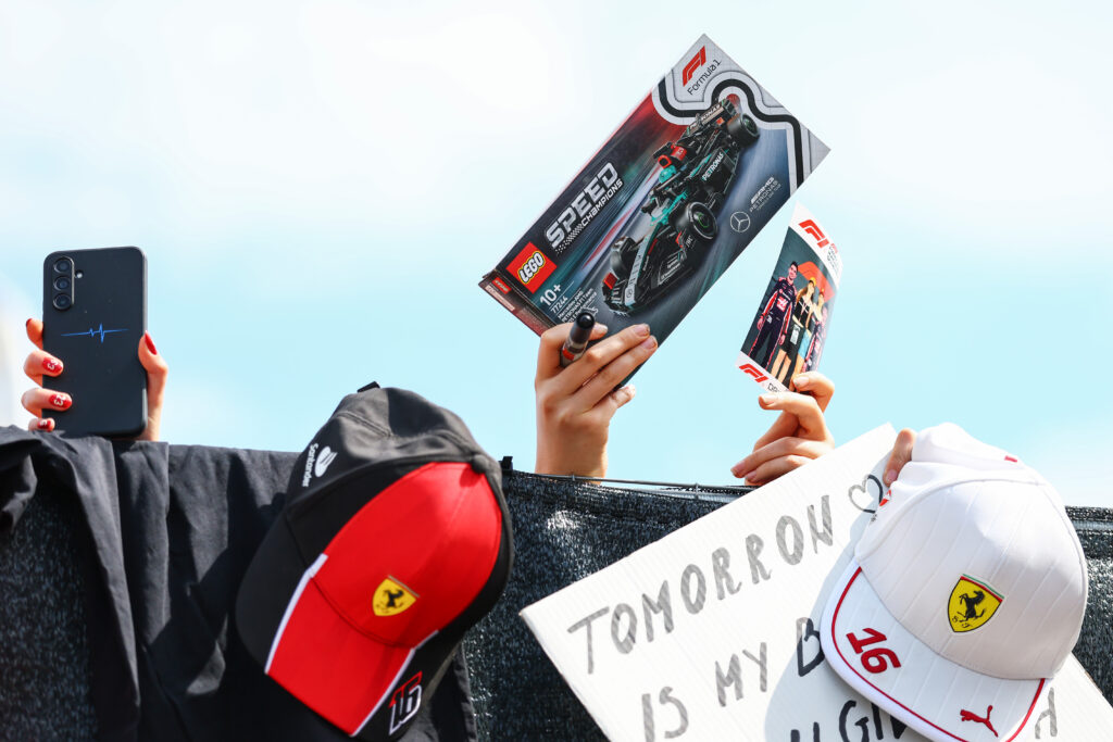 Fans holding F1 LEGO sets at the Final Practice of Grand Prix of Hungary
