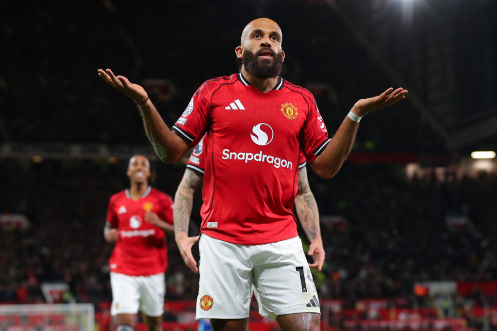 Bryan Mbeumo of Manchester United celebrates after scoring their side's third goal during a Premier League match.