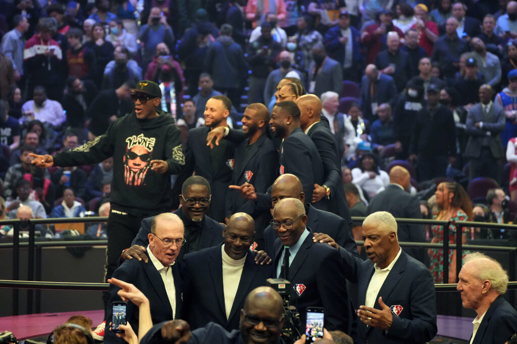 (Top L-R) Dennis Rodman, Stephen Curry, Chris Paul, Dwyane Wade, Ray Allen, Carmelo Anthony (Bottom L-R) Guest, Dominique Wilkins, Michael Jordan, James Worthy, Bob McAdoo, Julius Erving and Bill Walton pose for photos during the 2022 NBA All-Star Game at Rocket Mortgage Fieldhouse on February 20, 2022 in Cleveland, Ohio.