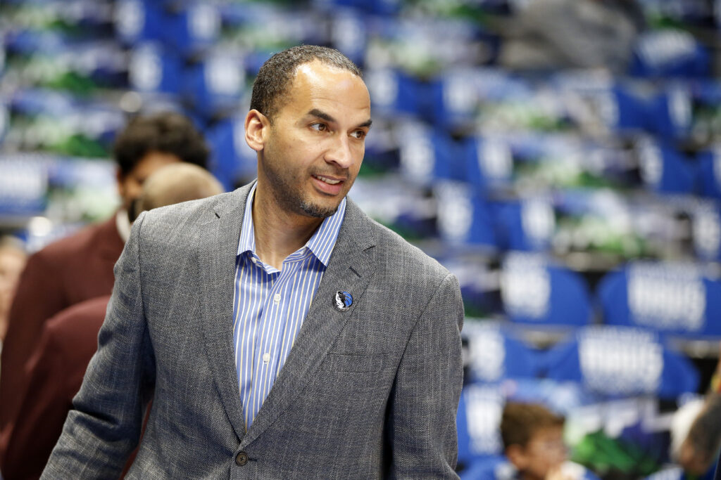 Nico Harrison of the Dallas Mavericks watches warmups before the game against the San Antonio Spurs at American Airlines Center.