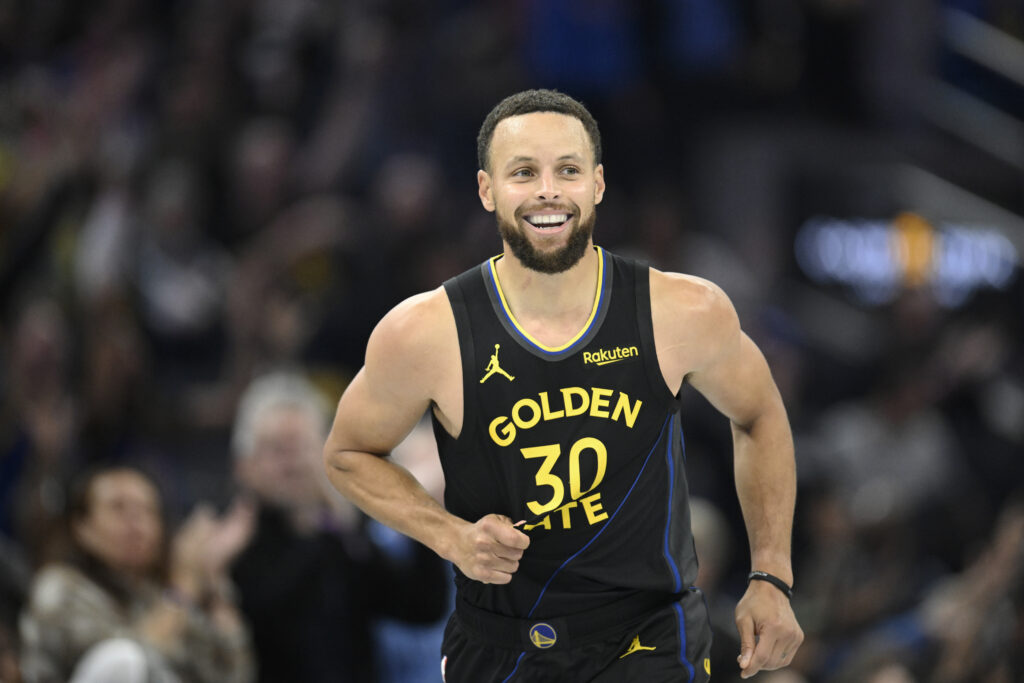Stephen Curry #30 of the Golden State Warriors celebrates a three-point basket against the Portland Trail Blazers in the second quarter during an NBA Cup game at Chase Center on November 21, 2025 in San Francisco, California.
