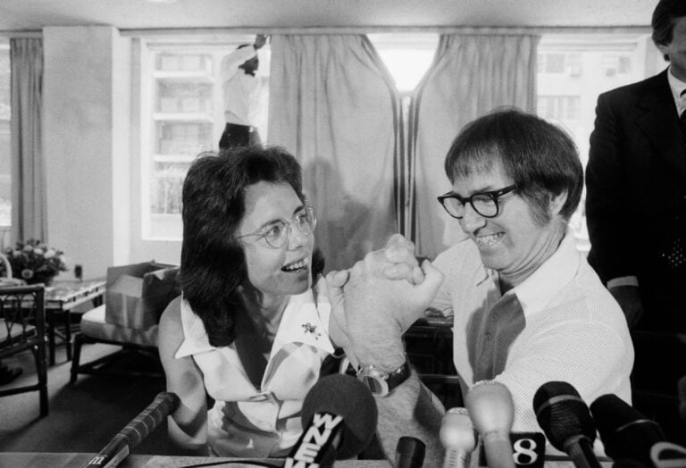 Former tennis great Bobby Riggs and top female tennis player Billie Jean King arm wrestle at a press conference, where they announced they'll face ...