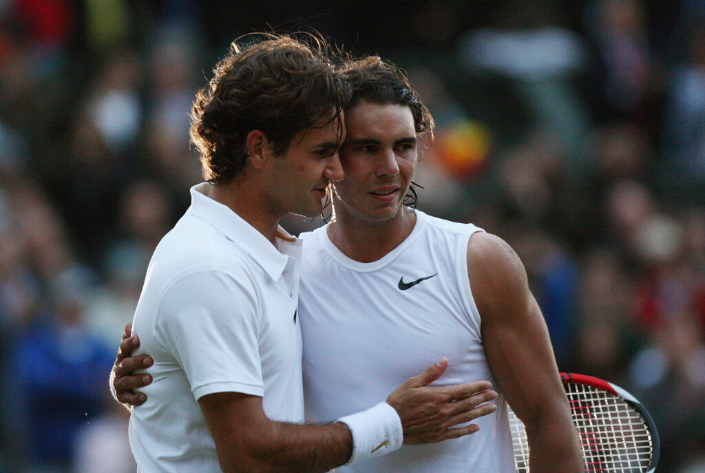 Roger Federer of Switzerland congratulates Rafael Nadal of Spain in winning match point and the Championship during the men's singles Final