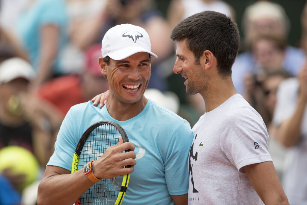 2018 French Open Tennis Tournament - Rafael Nadal of Spain and Novak Djokovic of Serbia while playing a tie break doubles exhibition match against Simone Halep of Romania and Alexander Zverev of Germany on Court Philippe Chatrier during a packed Children's Day at Roland Garros before the start of the 2018 French Open Tennis Tournament at Roland Garros on May 26th 2018 in Paris, France.