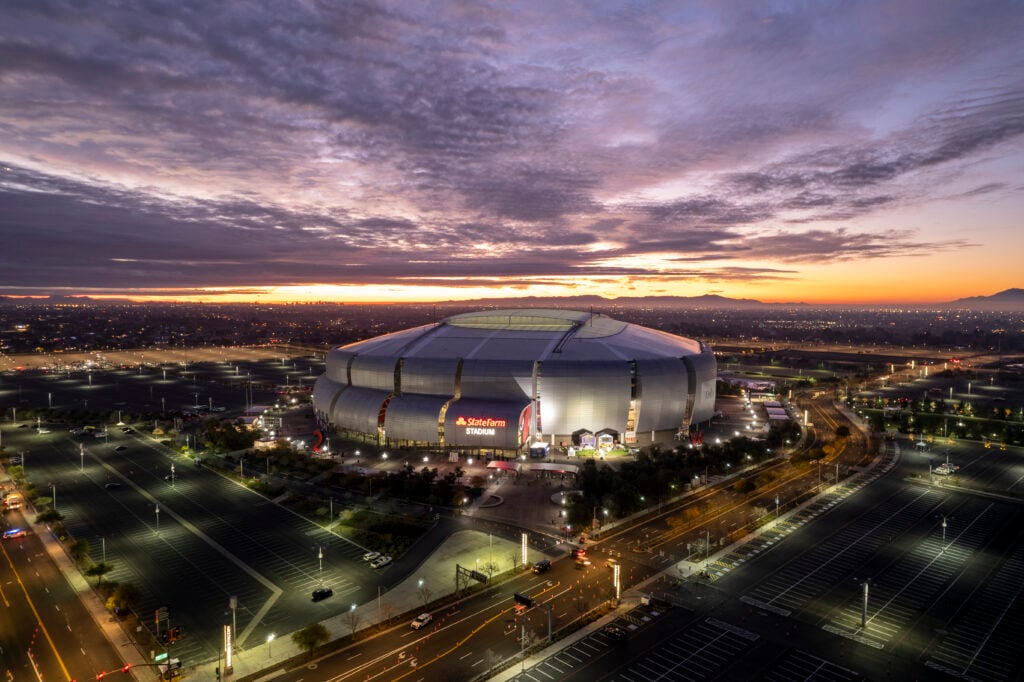 An aerial view of State Farm Stadium during sunrise.