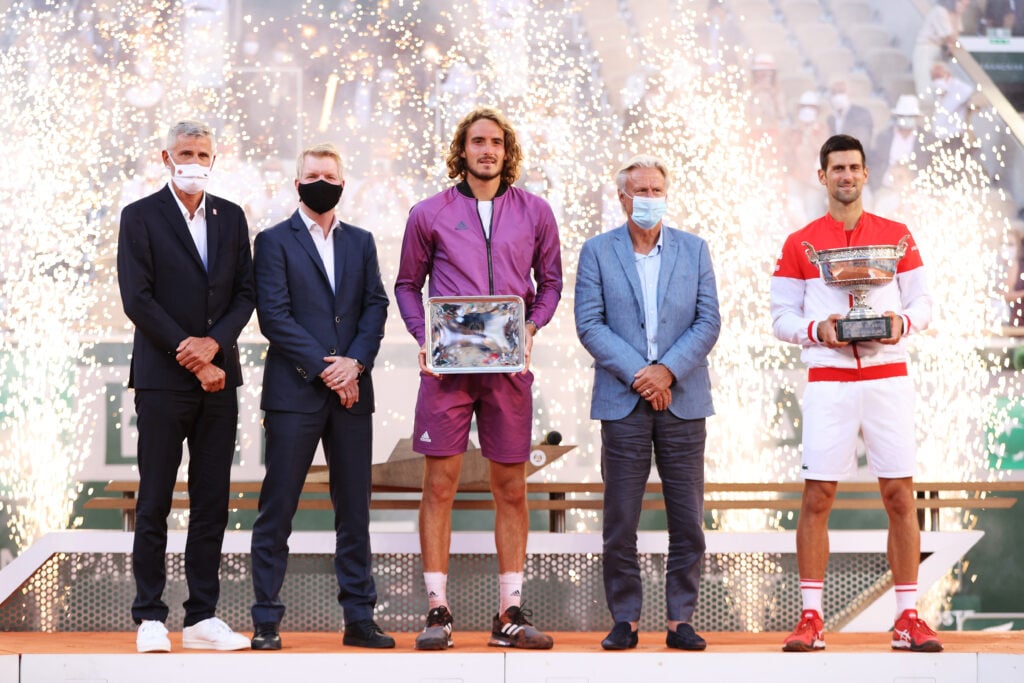 Novak Djokovic and Stefanos Tsitsipas pose with their trophies after the 2021 French Open final