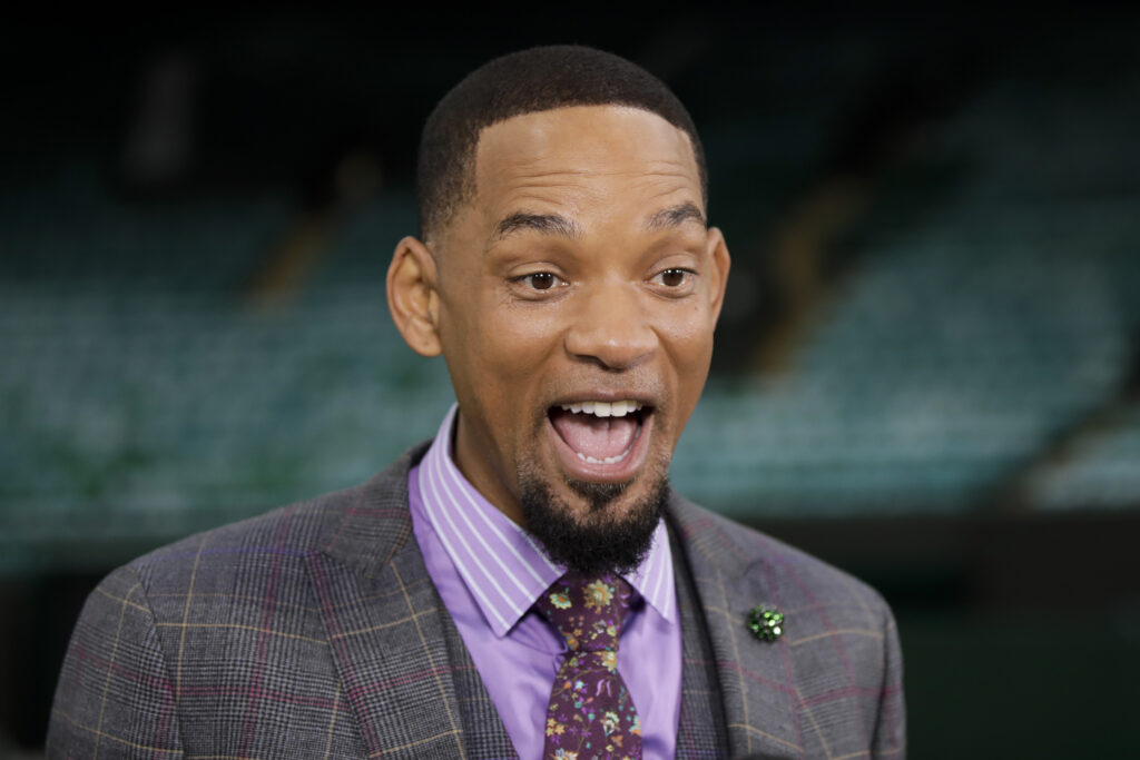 Will Smith smiles when attending Wimbledon in 2021.