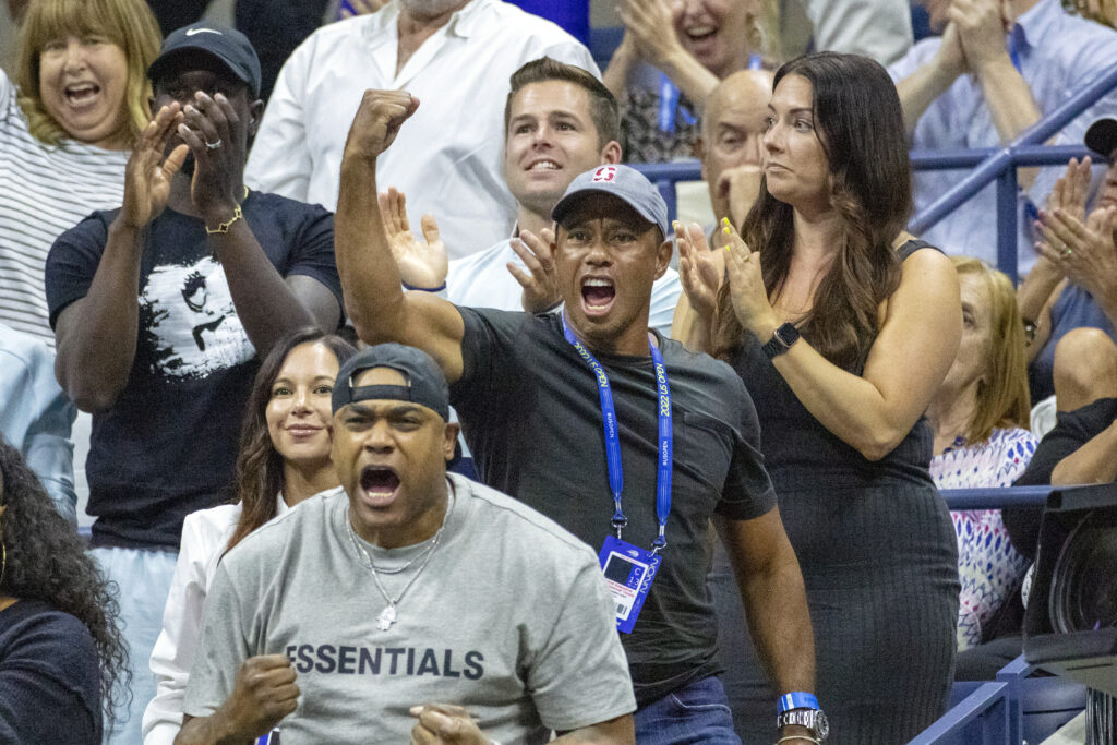 Tiger Woods reacts after Serena Williams wins the first set against Anett Kontaveit at the 2022 US Open.