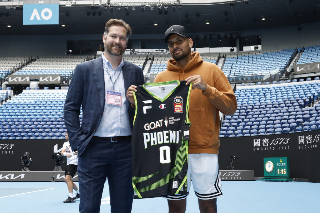 South East Melbourne Phoenix CEO Tommy Greer presents Nick Kyrgios with a Phoenix jersey during a South East Melbourne Phoenix NBL media opportunity at Rod Laver Arena on January 12, 2023 in Melbourne, Australia.