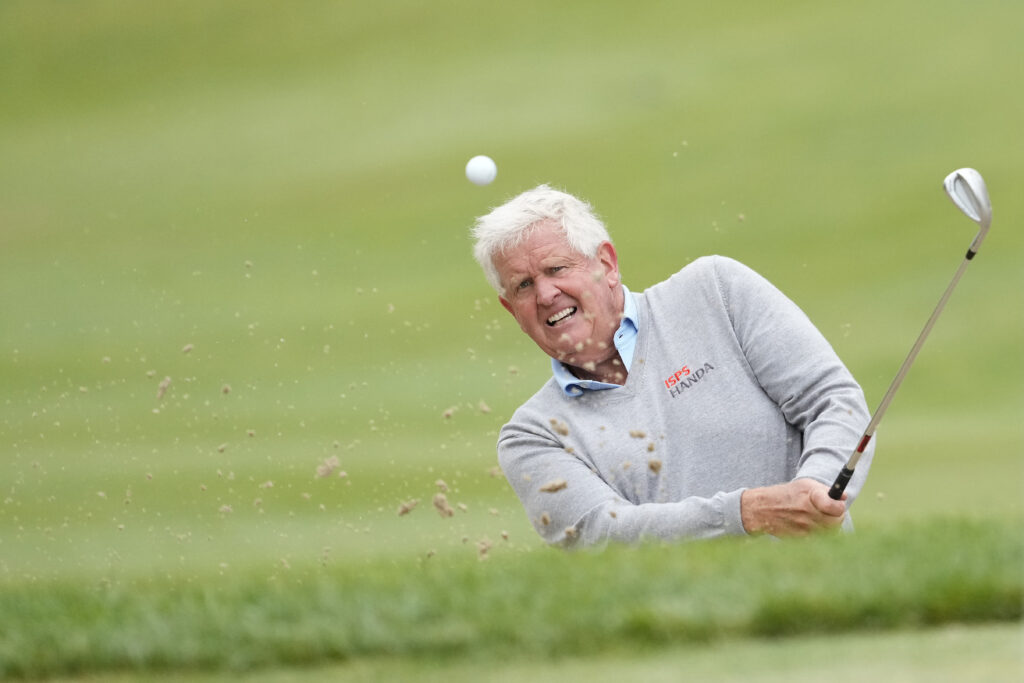 Colin Montgomerie of Scotland hits from a green side sand trap on the 13th hole during the final round of the American Family Insurance Championship