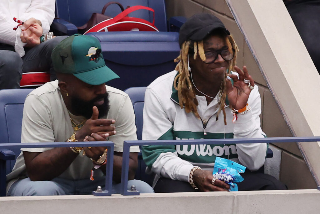 Lil Wayne looks on at the 2023 US Open.