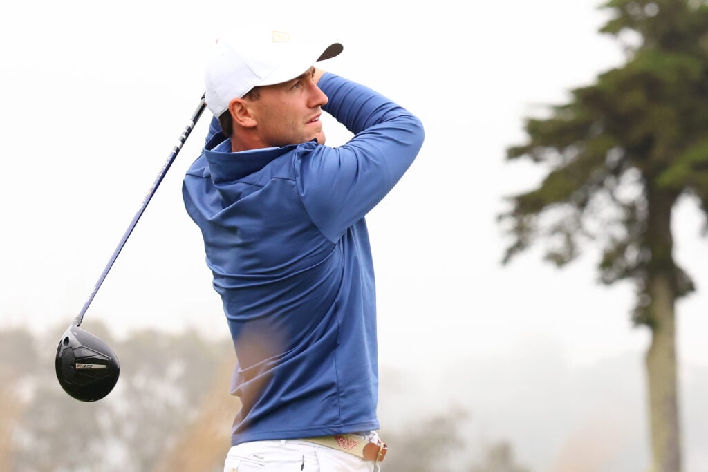Casper Ruud hitting a golf shot.