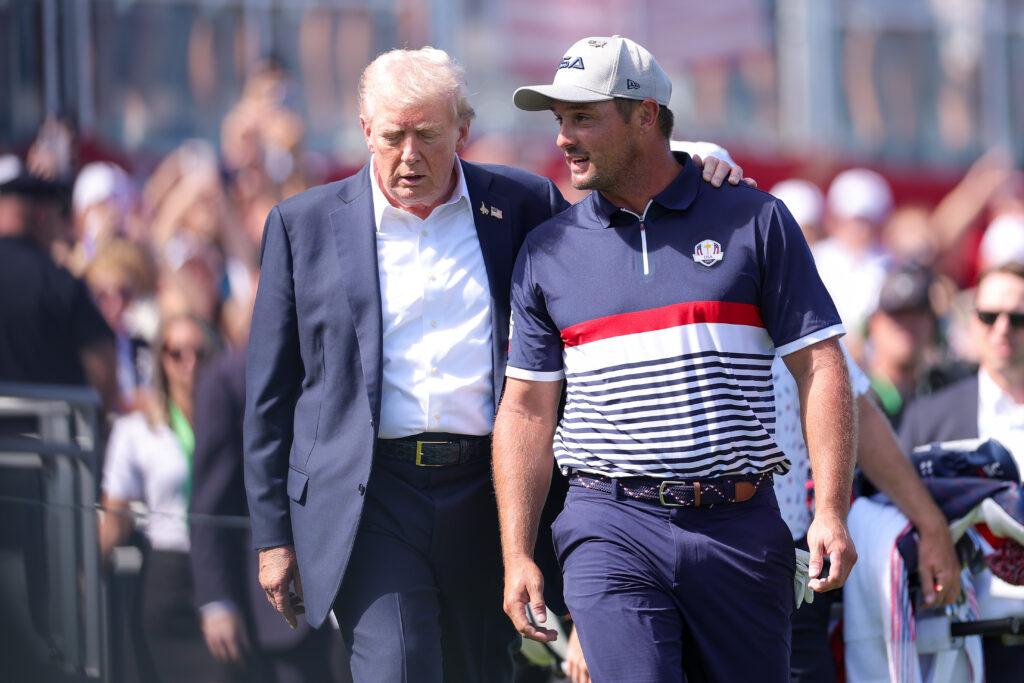 President Donald Trump speaks with Bryson DeChambeau ahead of the Friday four-ball matches of the 2025 Ryder Cup at Bethpage Black