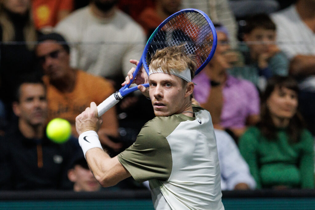 Denis Shapovalov plays a backhand against Joao Fonseca at the 2025 Paris Masters.