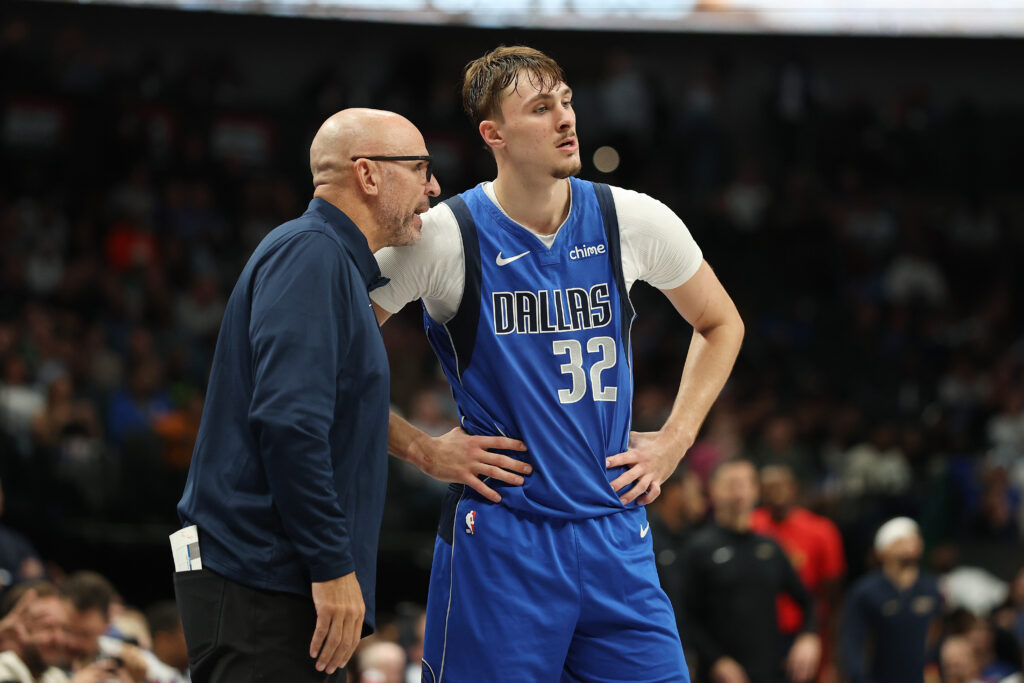 Cooper Flagg #32 of the Dallas Mavericks speaks with head coach Jason Kidd during the second half against the New Orleans Pelicans at American Airlines Center.