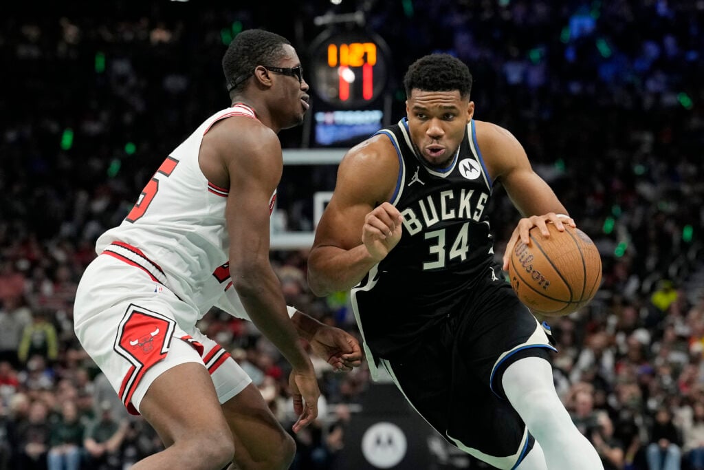 Giannis Antetokounmpo #34 of the Milwaukee Bucks dribbles the ball against Jalen Smith #25 of the Chicago Bulls in the fourth quarter during an Emirates NBA Cup game at Fiserv Forum