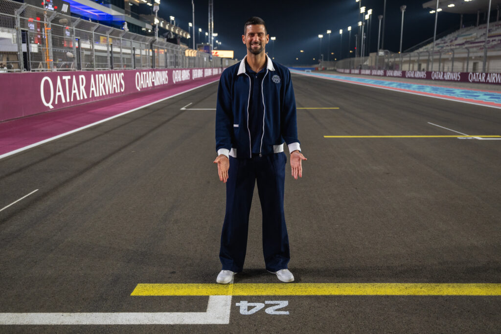 Novak Djokovic poses for a picture at the track of the Lusail International Circuit ahead of the Formula One Qatar Grand Prix.