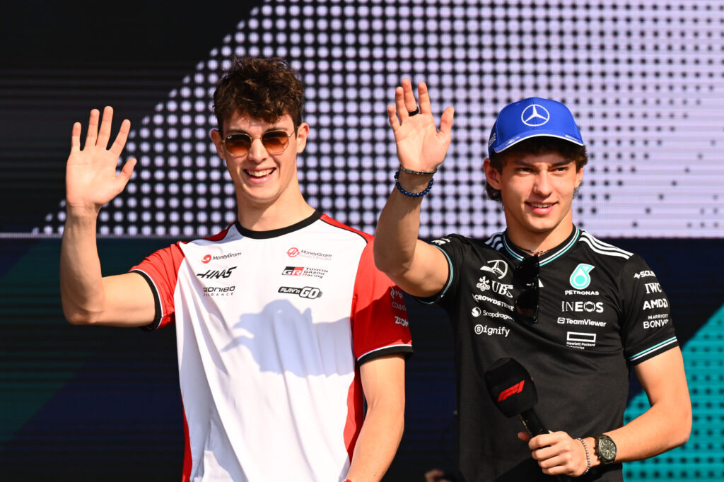 Oliver Bearman of Haas and Andrea Kimi Antonelli of Mercedes wave to the fans during the Qatar Grand Prix weekend
