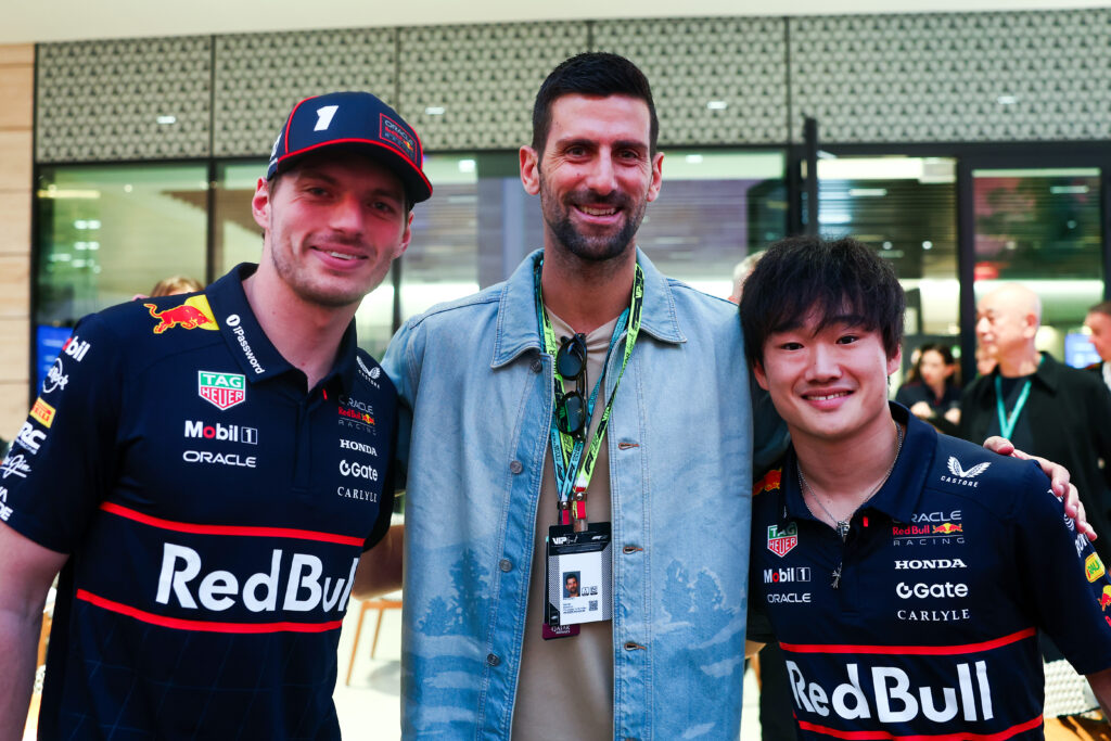 Max Verstappen of the Netherlands and Oracle Red Bull Racing and Yuki Tsunoda of Japan and Oracle Red Bull Racing with Novak Djokovic prior to the F1 Grand Prix of Qatar at Lusail International Circuit.