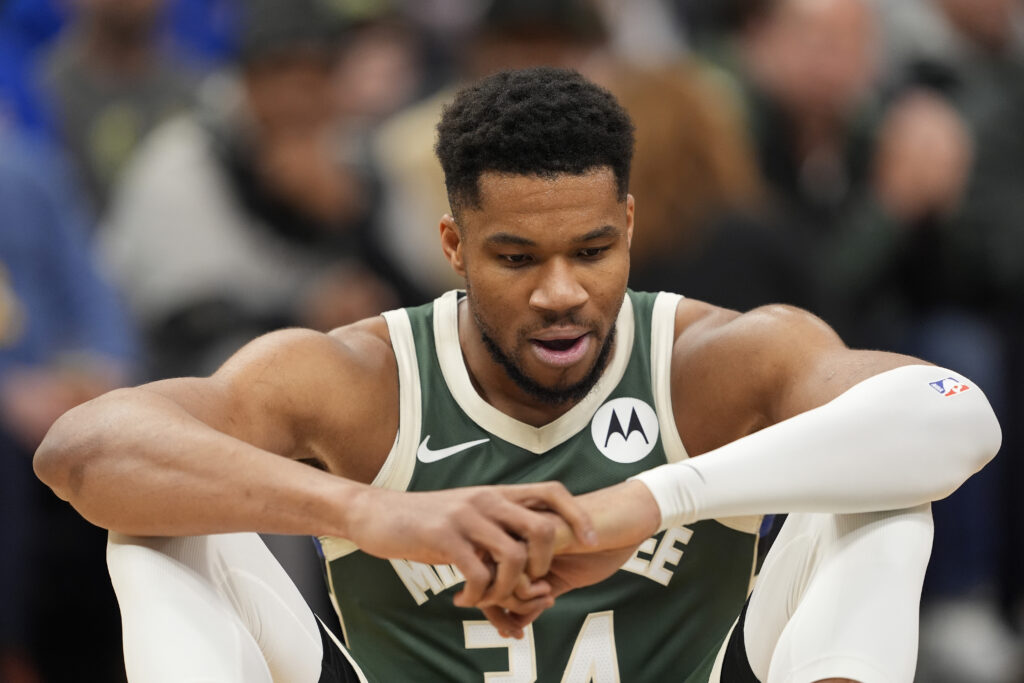 Giannis Antetokounmpo #34 of the Milwaukee Bucks reacts after an apparent injury against the Detroit Pistons during the first quarter at Fiserv Forum on December 03, 2025 in Milwaukee, Wisconsin.