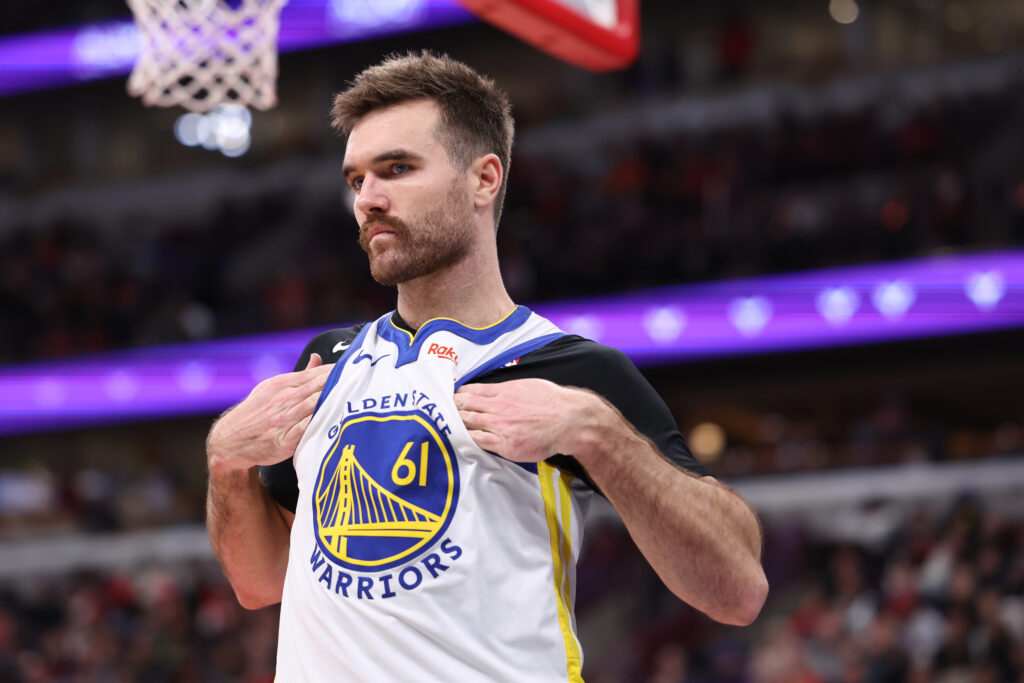 Pat Spencer #61 of the Golden State Warriors looks on against the Chicago Bulls at the United Center.
