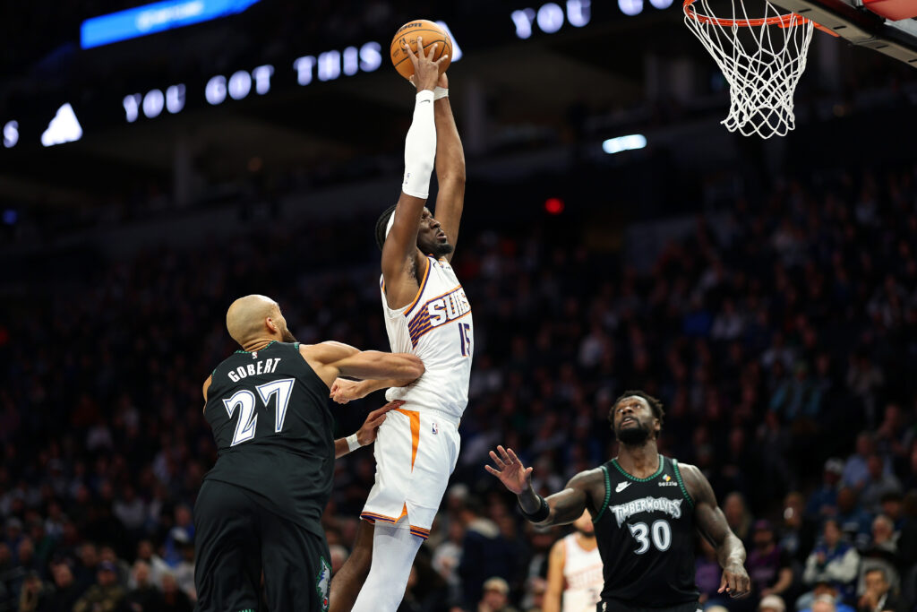 Rudy Gobert #27 of the Minnesota Timberwolves fouls Mark Williams #15 of the Phoenix Suns in the third quarter. Gobert was assessed a flagrant-two foul and was ejected from the game at Target Center.