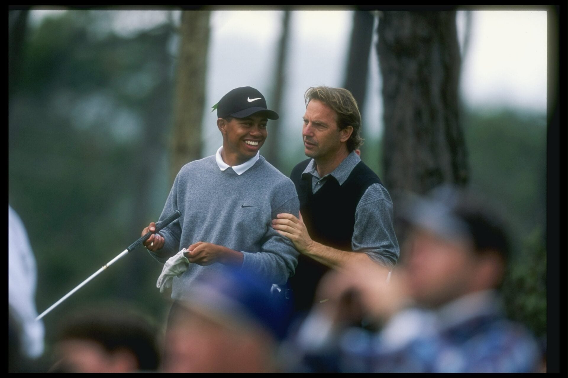 31 Jan 1997: Tiger Woods and actor Kevin Costner confer during the AT&T National Pro-Am at the Poppy Hills Golf Course in Pebble Beach, Califor...