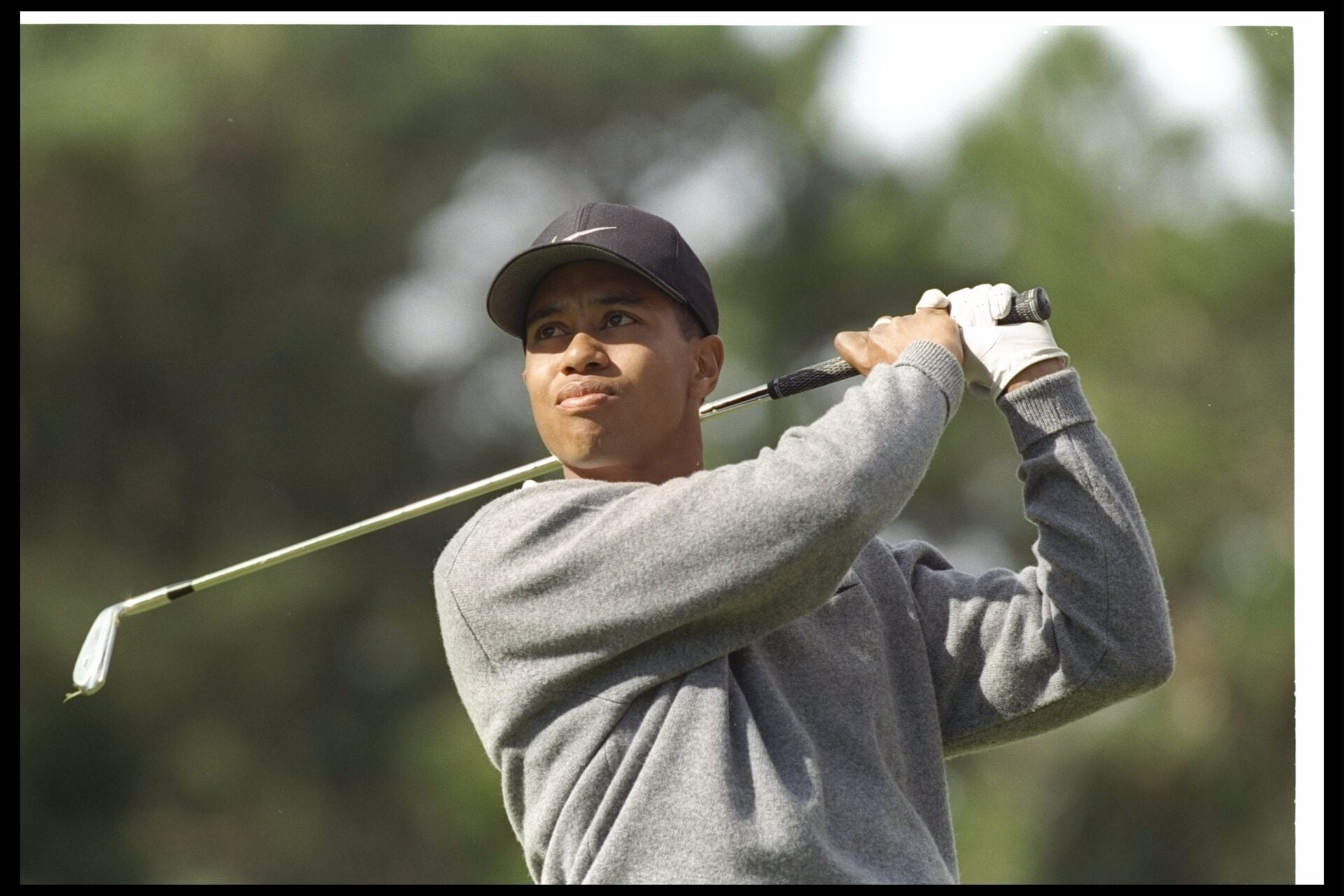 31 Jan 1997: Tiger Woods watches the ball fly during the AT&T National Pro-Am at the Poppy Hills Golf Course in Pebble Beach, California.
