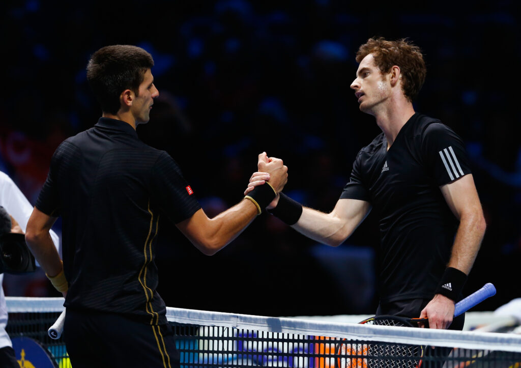 Novak Djokovic and Andy Murray shake hands after their match at the 2014 ATP Finals