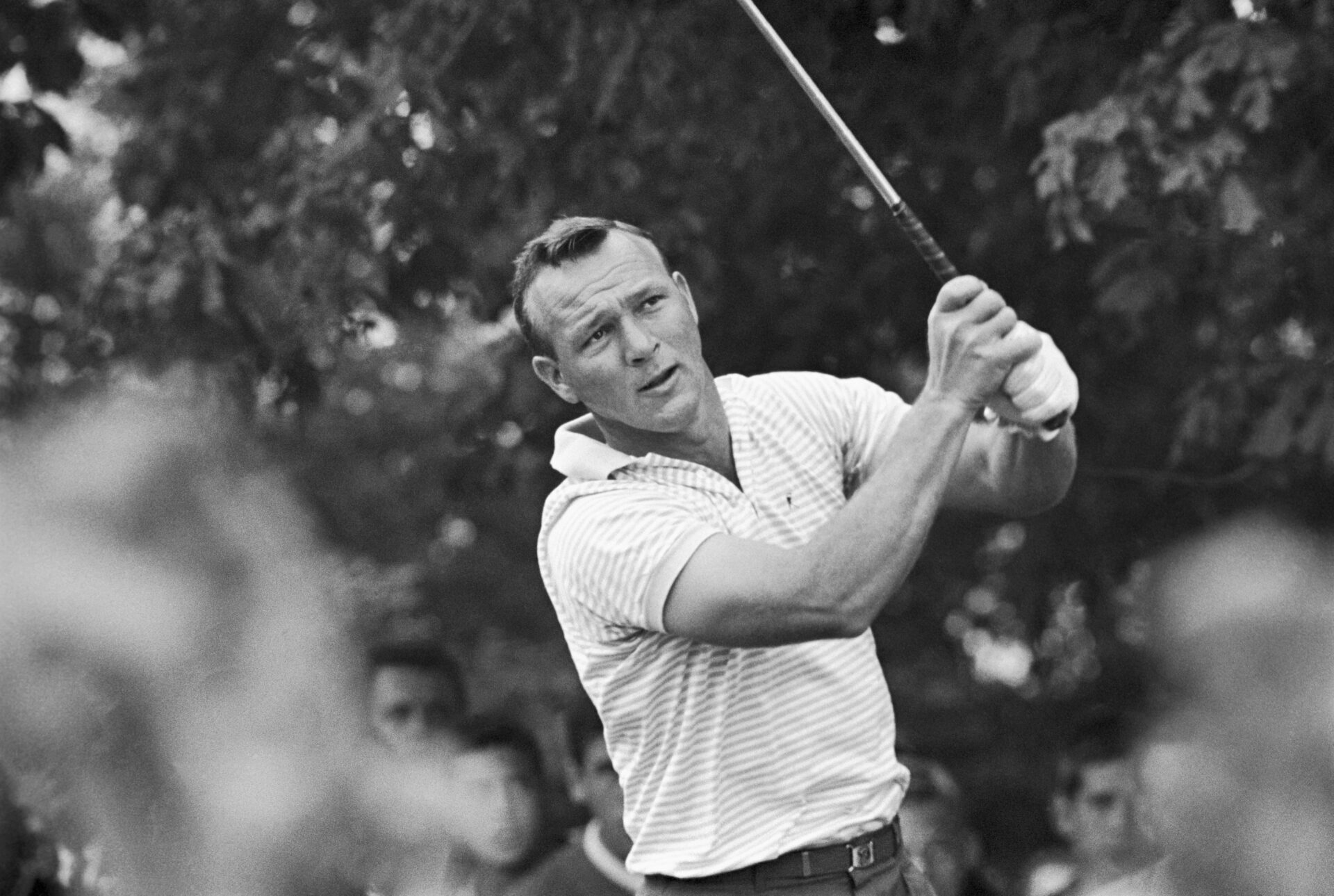 (Original Caption) Arnold Palmer tees off on the 10th hole with a good margin of lead over Phil Rodgers and Jacky Cupit. Palmer went on to win the ...