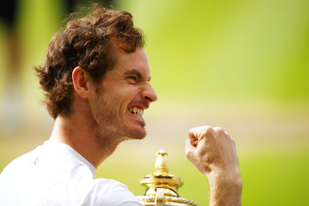 Andy Murray celebrates with the title after winning Wimbledon in 2016