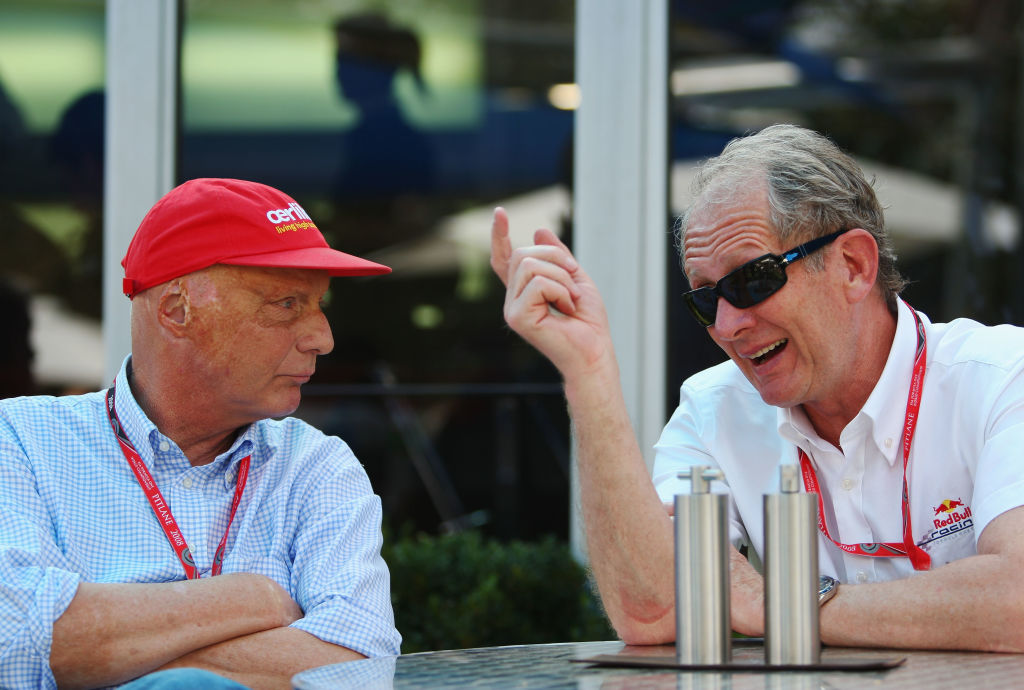 Niki Lauda and Helmut Marko chatting inside the F1 paddock during the 2008 Australian Grand Prix.